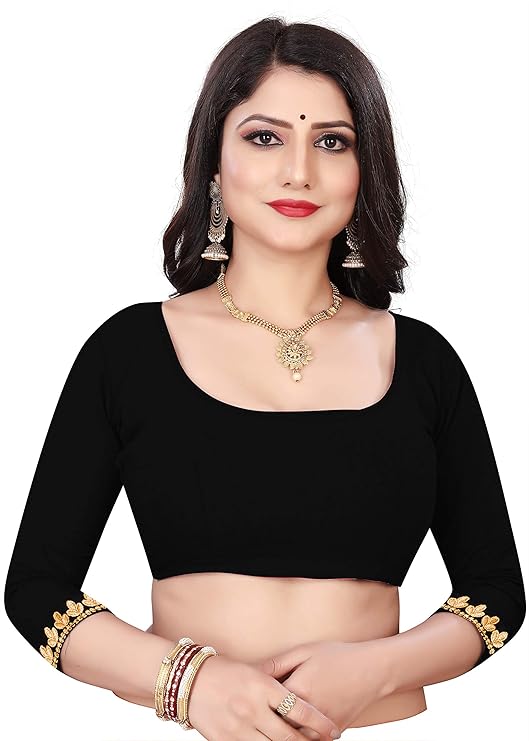 Woman wearing a black blouse with gold details on a white background