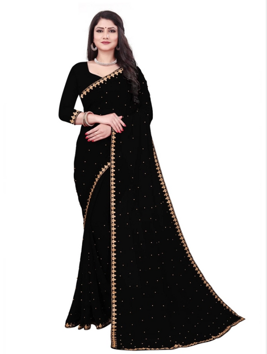 Woman wearing a black saree with gold border on a white background