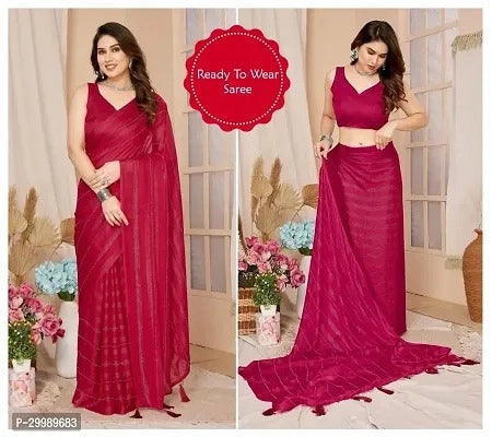 Woman wearing a red saree with a floral background