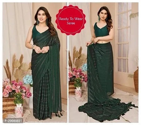 Woman wearing a green saree with a floral background