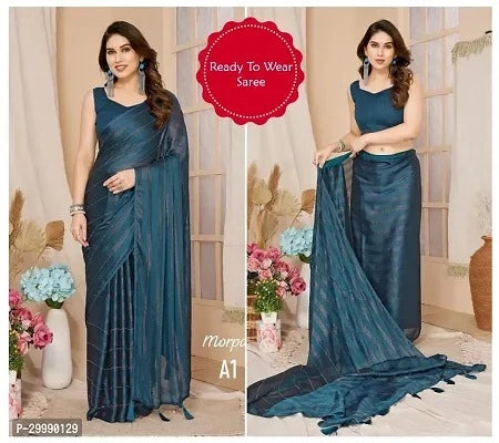 Woman wearing a blue saree with floral decorations and a 'Ready To Wear Saree' label.