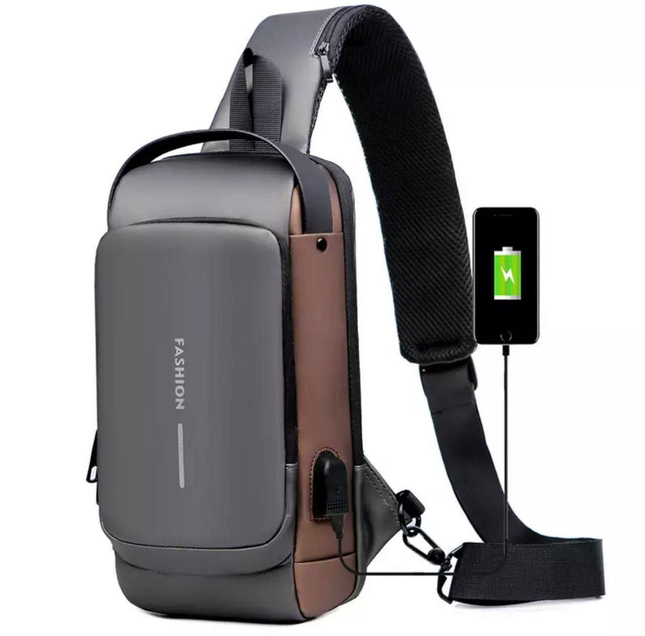 Gray and brown sling bag with USB port and smartphone showing battery icon on a white background